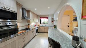 a large kitchen with a large stove top oven at Tango Andaluz - Sunset Ritual Incl in Fuengirola +127 photos