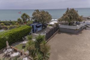 an aerial view of a food truck parked next to the beach at The Beachcroft Hotel, BW Signature Collection in Bognor Regis