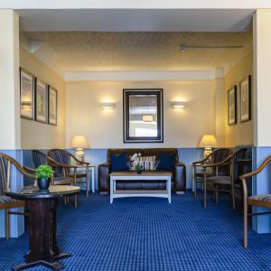 a waiting room with a couch and chairs at The Beachcroft Hotel, BW Signature Collection in Bognor Regis