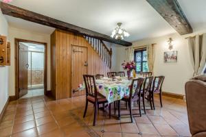 a dining room with a table and chairs at 3 Bed in Acle oc-b41410 in Acle