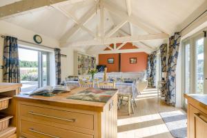 a kitchen and dining room with a table and chairs at 3 Bed in Briningham oc-s44878 in Banningham