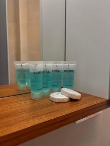 a shelf with four bottles of hair products on it at Fughuro cottage in Bakuriani