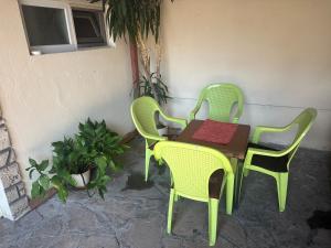 a table with two chairs and a table with at Apartman Kostadinovic in Pirot