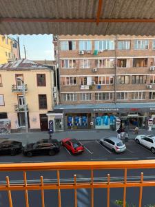 a view of a street with cars parked in front of buildings at best hotel yerevan in Yerevan