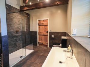 a bathroom with a sink and a shower at Ragged Hall Barn in Settle +23 photos