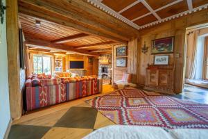 a living room with a couch and a rug at Jagdhaus Umlberg in Umlberg