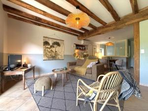 a living room with a couch and a table at Pegartea in Mendionde