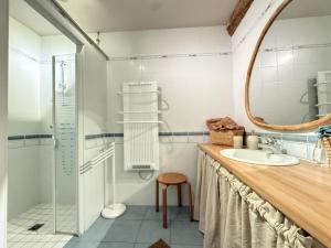 a bathroom with a sink and a mirror at Pegartea in Mendionde +27 photos
