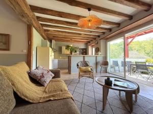 a living room with a couch and a table at Pegartea in Mendionde