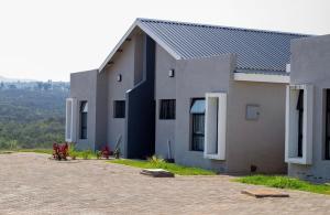 a building with a lot of windows on the side at Ultimate Lotus in Manzini
