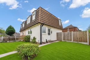a house with a green lawn in front of it at Haregate House 3BR Leek Peak District Sleeps 5 in Leek