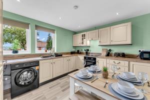 a kitchen with white cabinets and a dishwasher at Haregate House 3BR Leek Peak District Sleeps 5 in Leek