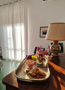 a table with a tray of food on a table at Il Mulino in Locri