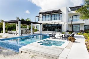an image of a house with a swimming pool at Pestica Villa Private Pool in Leeward