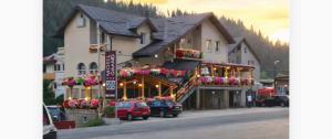 a large building with flowers in front of it at Motel Grand in Rožaje