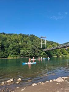 a group of people in the water in a river at Apartman Sadba 2 in Goražde