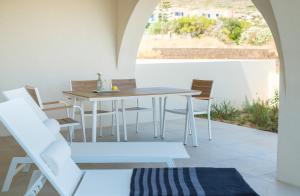 a dining room with a table and chairs at Villa Selina 2 - Etheras Properties in Kythira