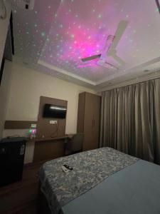 a bedroom with a ceiling with a ceiling fan at Corestay in Greater Noida