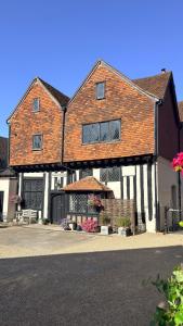 a large brick building with a lot of windows at Taylour House - Edenbridge, sleeps 10, historic, unique yet modern in Kent
