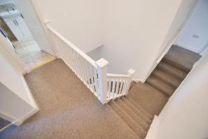 an overhead view of a white staircase with carpet at Villa Farm York in York