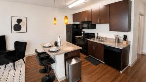 a kitchen with black appliances and a counter top at Luxe Nest King Studio Downtown 2B3 in Birmingham