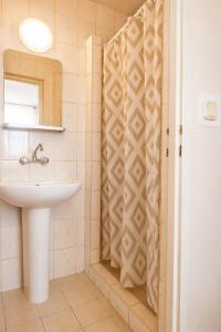 a bathroom with a sink and a mirror at DW Viva in Rewal +14 photos