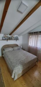 a bedroom with a bed in a room at Tabia Condo in Ljubuški