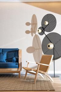 a living room with a chair and a couch at INNSiDE by Meliá Costablanca in Benidorm