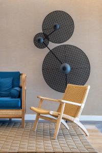 a living room with a chair and a table at INNSiDE by Meliá Costablanca in Benidorm