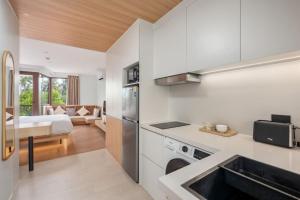 a kitchen with a sink and a counter top at Modern Studio at Wing Samui in Bophut