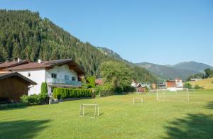 a field with two soccer goals in the grass at Appartement Neumayer in Viehhofen