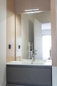 a bathroom with a sink and a mirror at Villa Lagoon in Carnon-Plage +52 photos