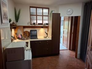 a kitchen with a sink and a counter top at Penzion U školy in Staré Město