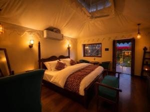 a bedroom with a large bed in a tent at Jawai Garh Resort in Bīsalpur