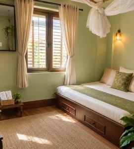 a bedroom with a bed and a window at Sanjog's B&B in Bhaktapur
