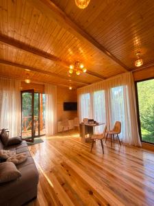 a living room with a couch and a table at SymphonyA in Gorists'ikhe