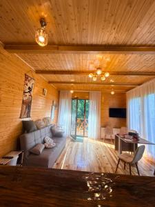 a living room with a couch and a table at SymphonyA in Gorists'ikhe +64 photos