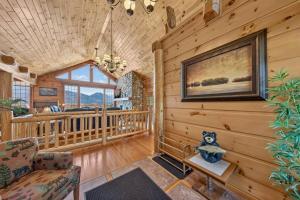 a living room in a cabin with wooden walls at Mountain View Log Home in Invermere in Invermere