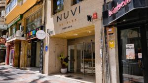 a store front of a building on a city street at Nuvi Mercado in Alicante