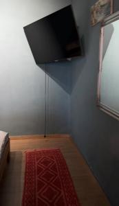 a room with a flat screen tv on a wall at Бухта in Nova Dofinivka