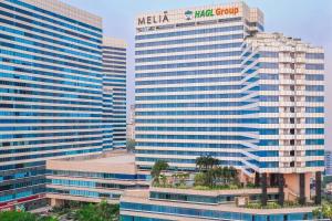 a group of tall buildings in a city at Meliá Yangon in Yangon