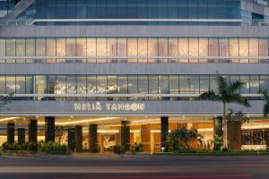 a large building with a mexia yangon sign on it at Meliá Yangon in Yangon