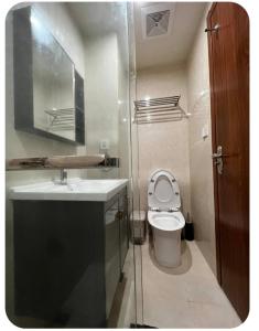 a small bathroom with a sink and a toilet at Megatower 4 Diorite Unit in Baguio