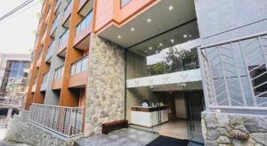 a large building with a large entrance to it at Megatower 4 Diorite Unit in Baguio