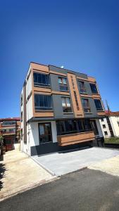 a building that is sitting on the side of a street at Galfa House in Bostancı