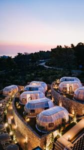 a group of domes lined up in a row at Piccolo Paradiso - Glamping Resort in Shëngjin