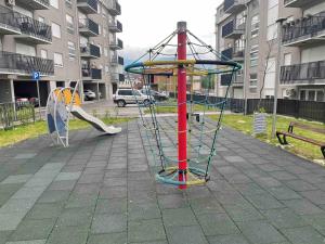 a playground with a slide and a swing set at Sophia in Vranje