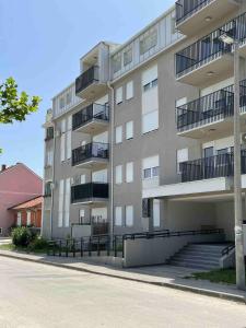 a large apartment building with stairs in front of it at Sophia in Vranje