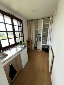 a kitchen with a sink and a counter top at Le Pavillon in Vendôme