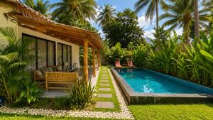 a house with a swimming pool next to a resort at Sawan villa in Hinkong